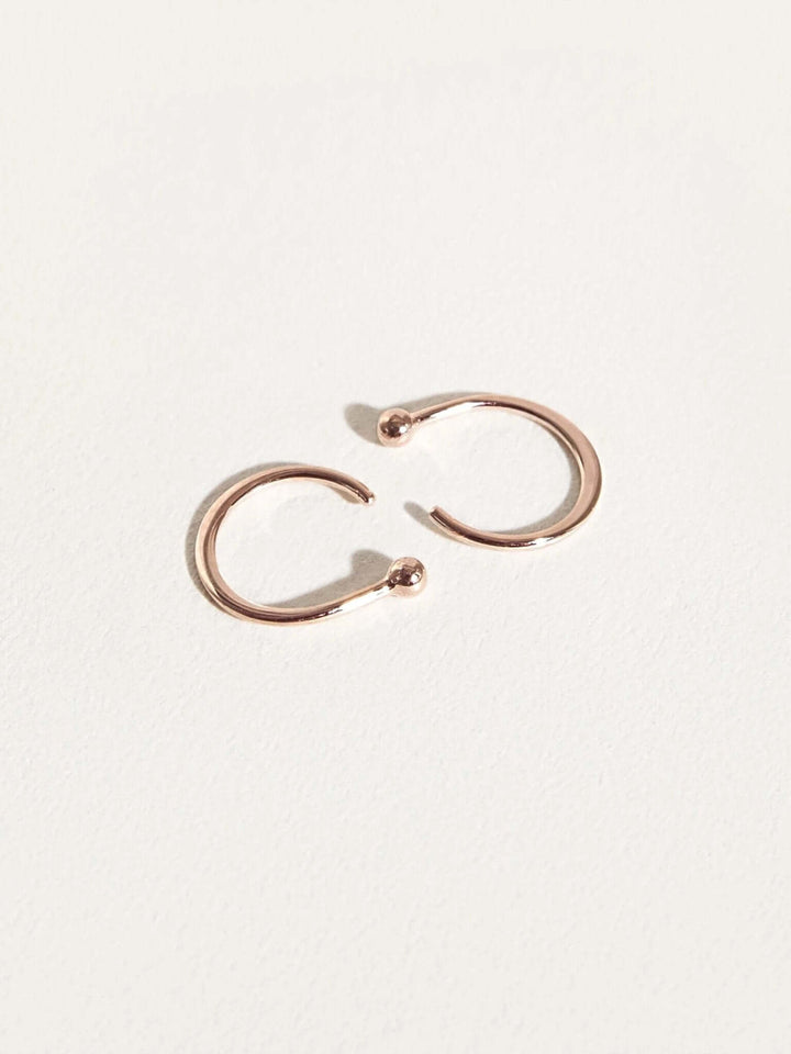 Aalami Gold Huggie Hoop Earrings - 18K Rose Gold Platedcartilage earringsCrystal EarringsLunai Jewelry