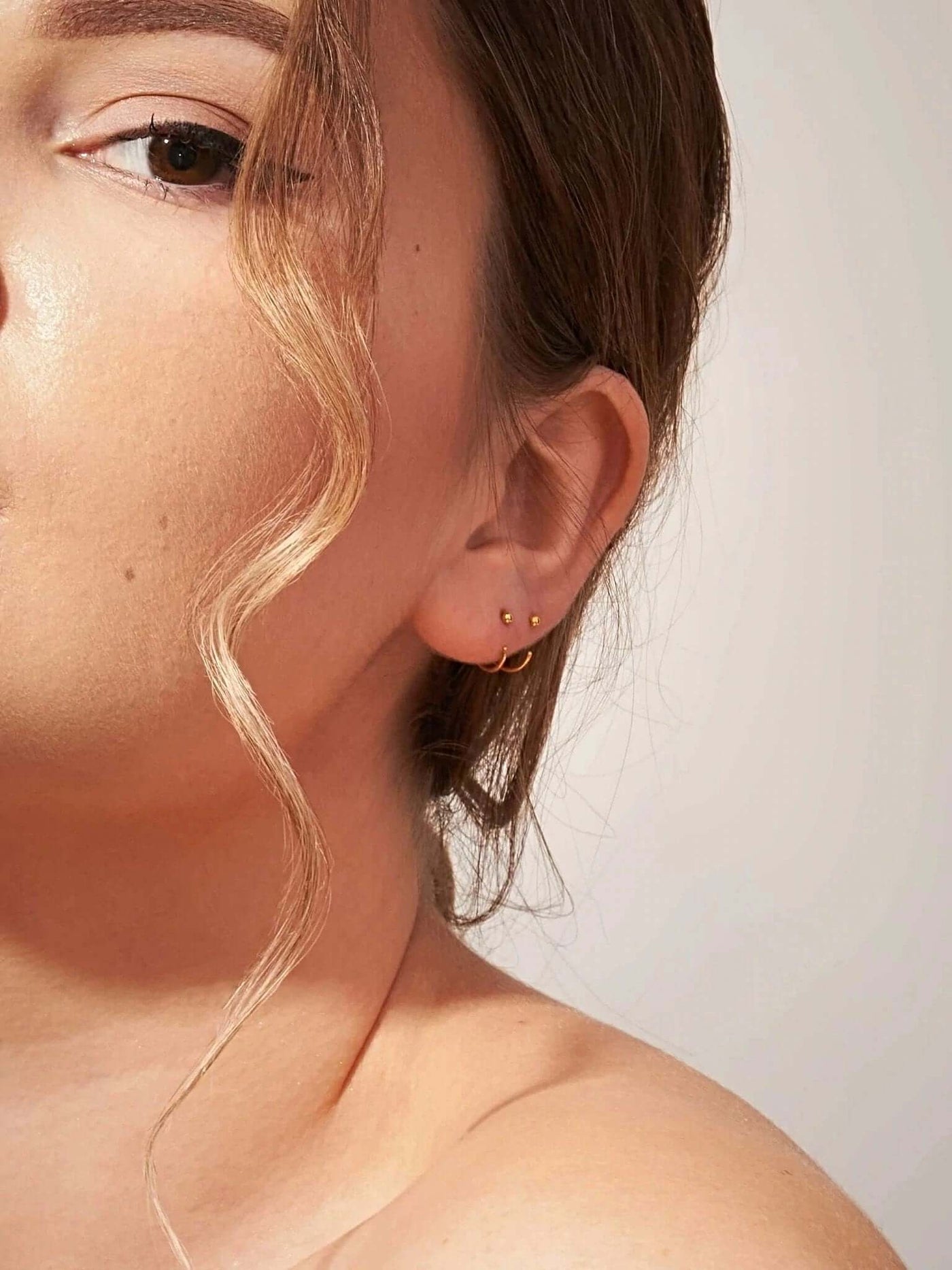 Aalami Gold Huggie Hoop Earrings - 24K Gold Platedcartilage earringsCrystal EarringsLunai Jewelry