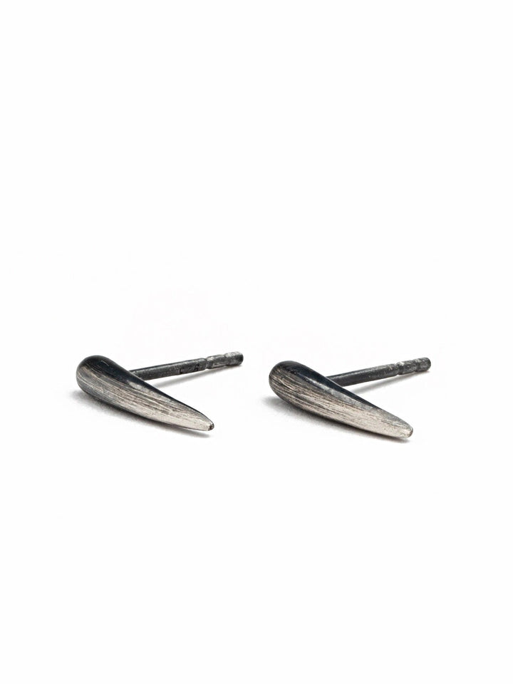  "Close-up of Aura Dainty Tusk Earrings showcasing intricate design"