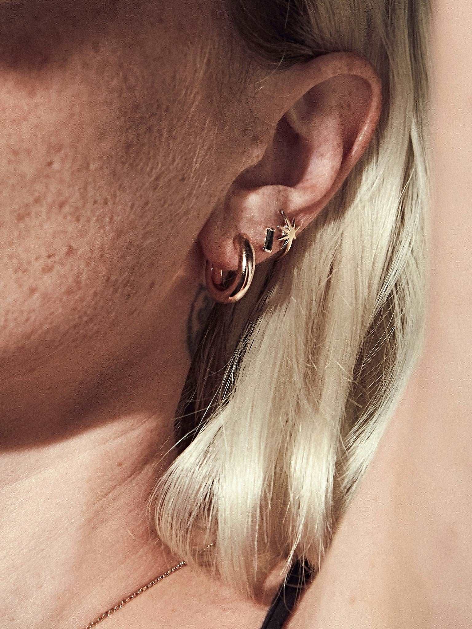 Birte hoop earrings layered or styled — versatile, handcrafted elegance in gold and silver.