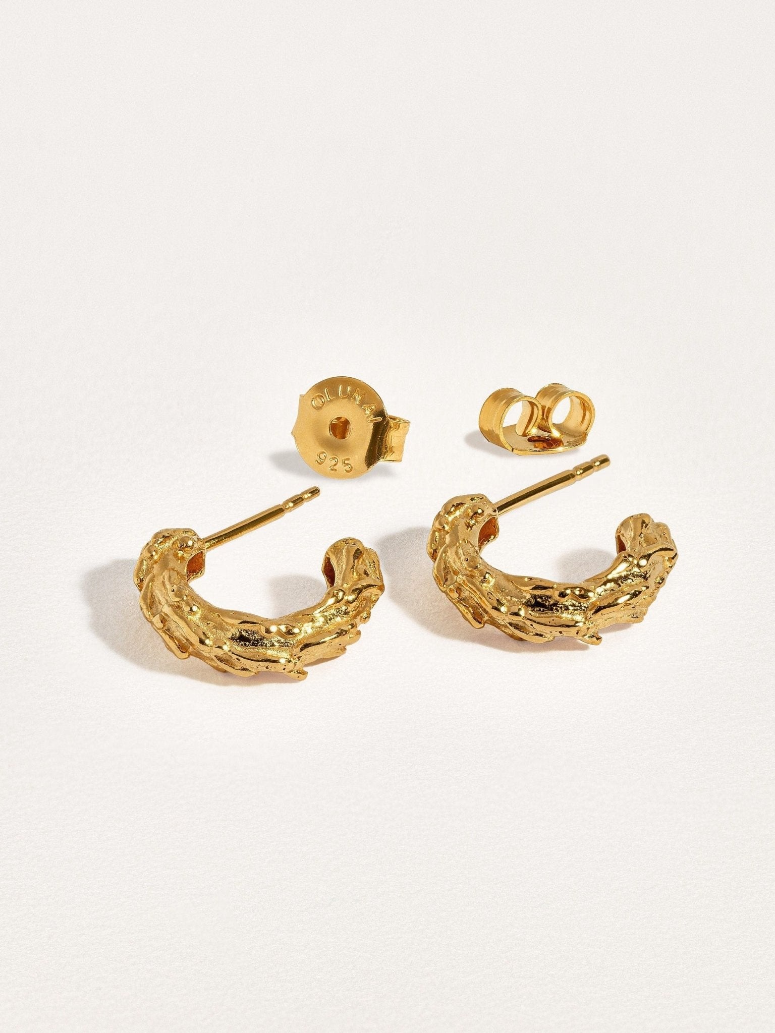Groessa Raw Texture Open Hoop Earrings in gold with organic textured design.