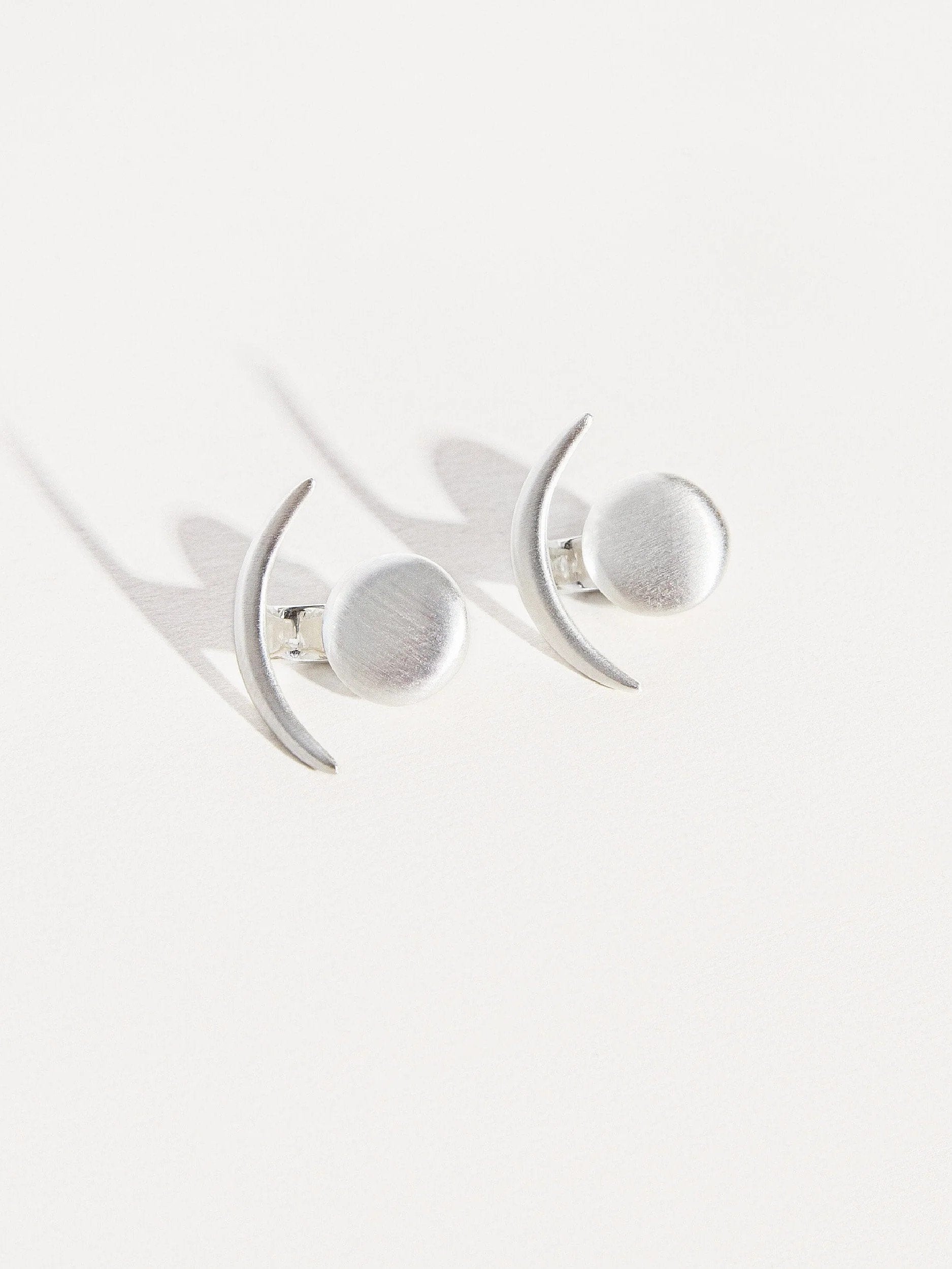  Sterling silver ear jackets, photographed on a white background with soft lighting.