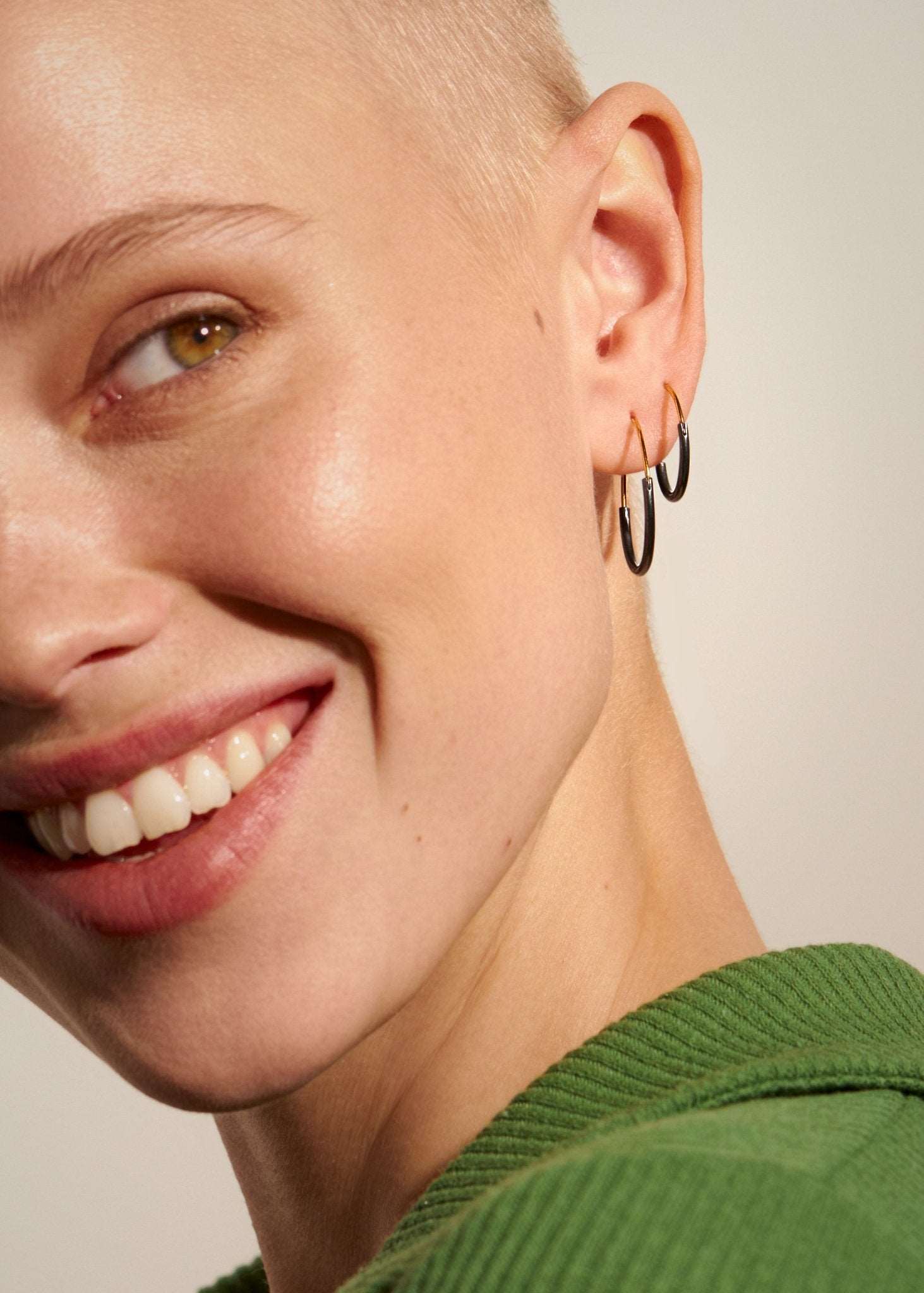 Kim small hoop earring in gold filled — worn with a soft smile, delicate and radiant.