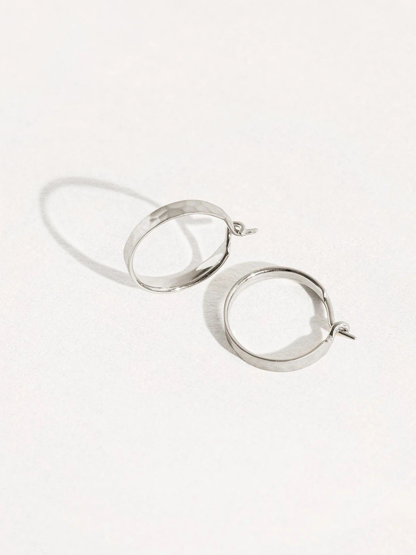 Medium hammered 925 sterling silver matte hoop earrings – chic and versatile design.