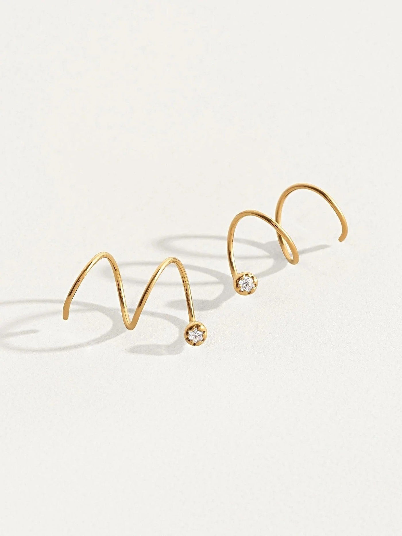 Liria Spiral Earrings - Pair925 Sterling Silver• Stone: 2mm White Zircon.BackUpItemsBirthstone EarringsLunai Jewelry