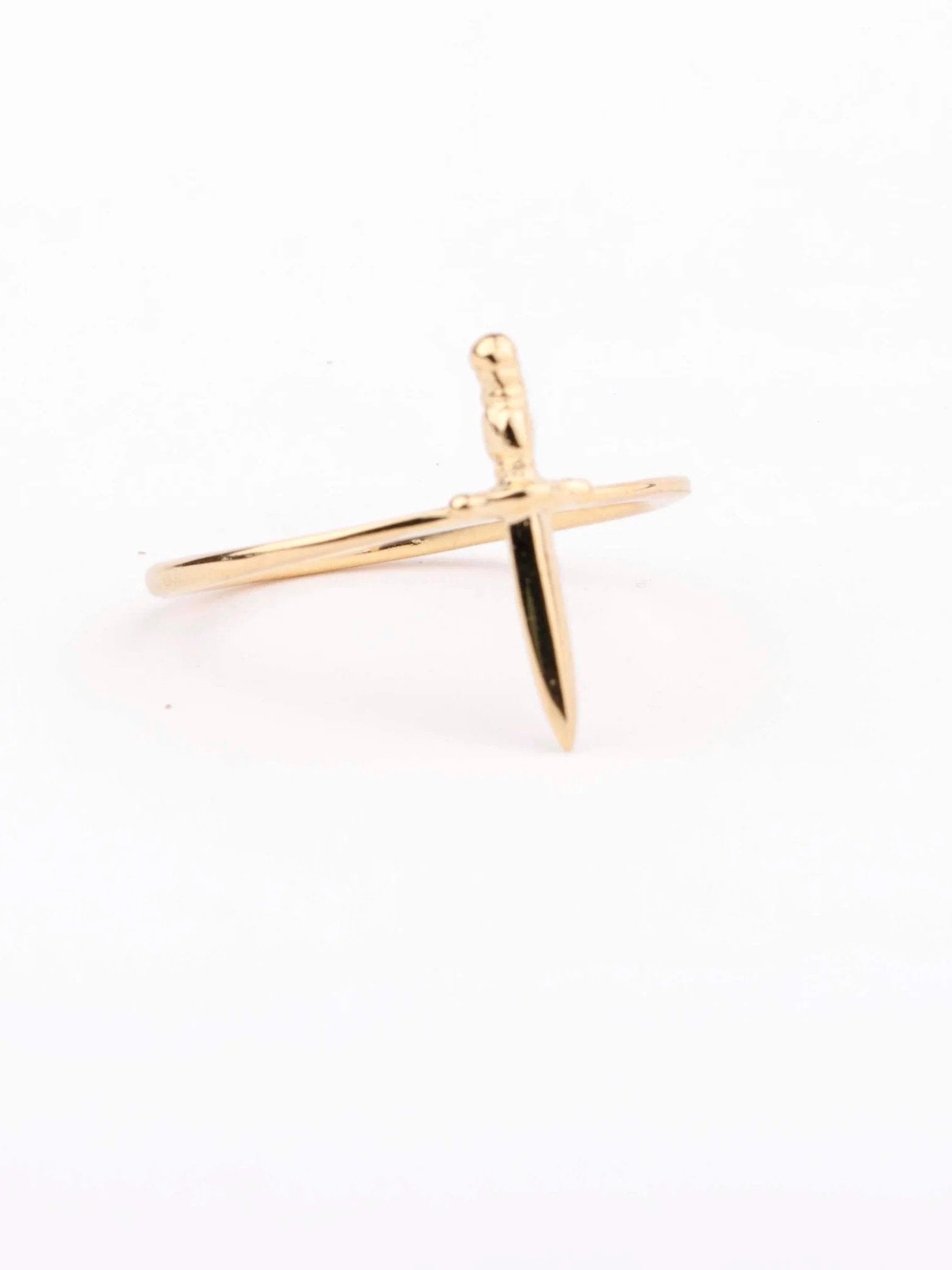 Tiny dagger ring in 24K gold vermeil, photographed on white background.