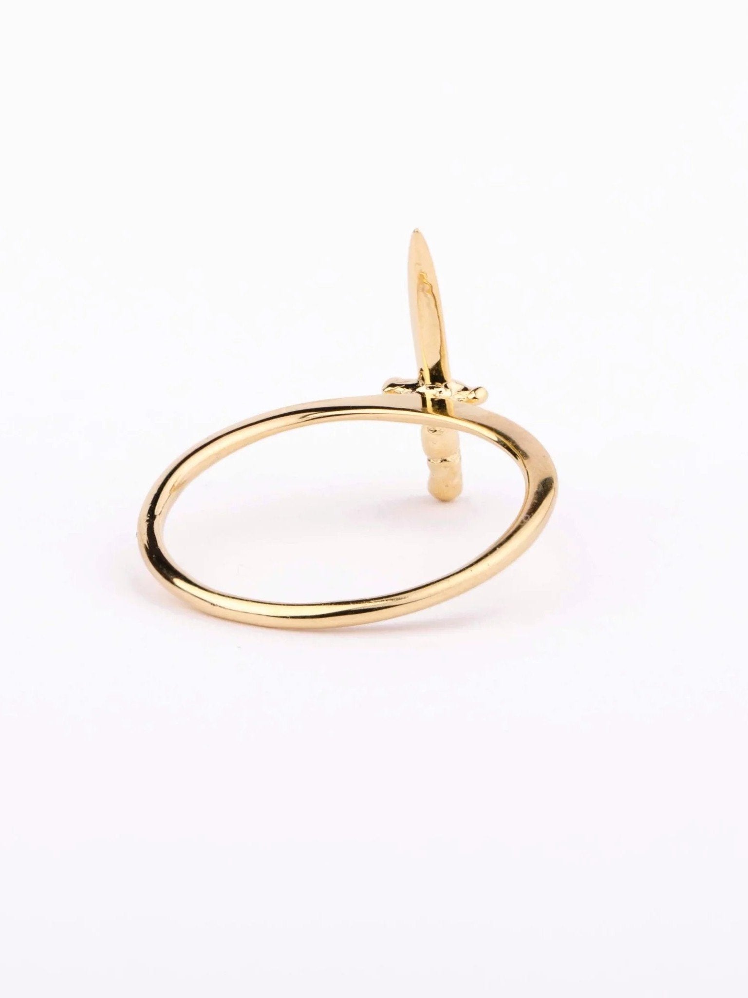 Side angle of gold vermeil dagger ring showing its delicate pointed detail.
