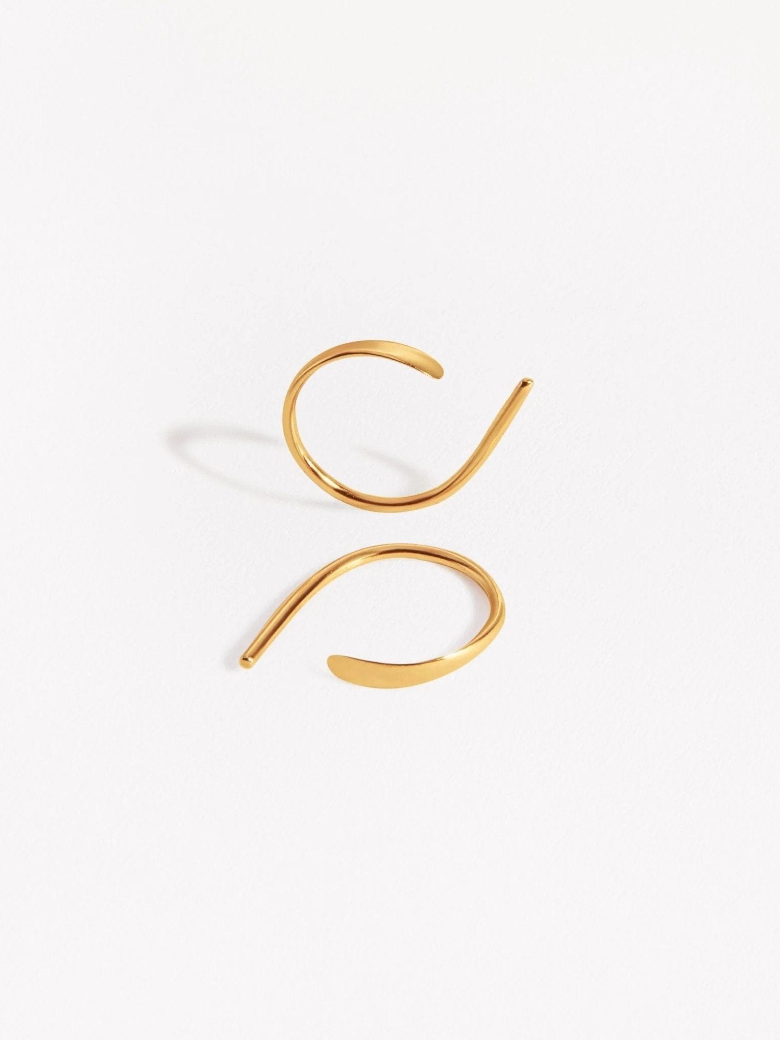 Noe hammered hoop earrings in sterling silver — handcrafted minimalist design on white background.