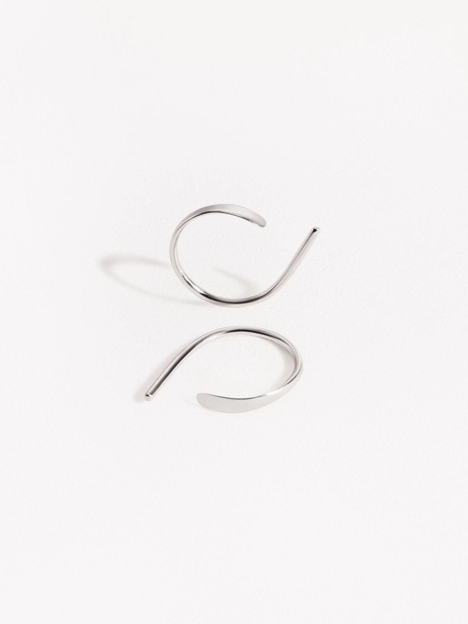 Sterling silver Noe hoop earrings with hammered front — handcrafted modern minimalist style.