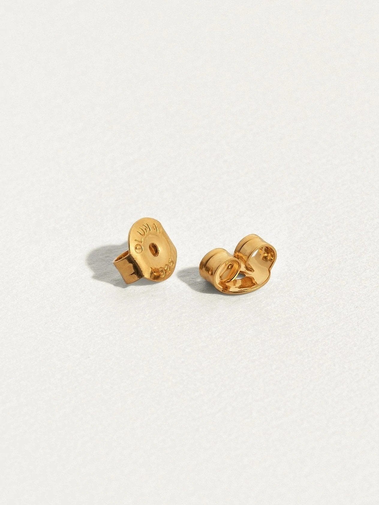 Sita bar earrings in 24K gold plated finish with butterfly backs — minimal design shown flat.