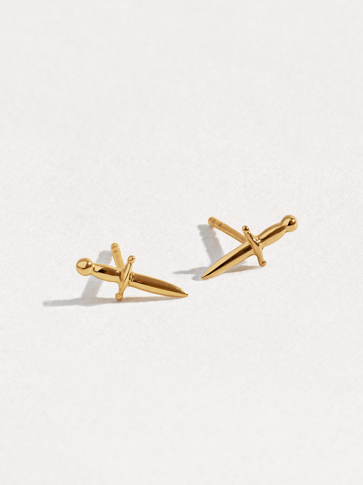 Side view of Tessa Sword Stud Earrings in 24K Gold Plated – Elegant dagger design